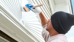 Exterior painter working in shade