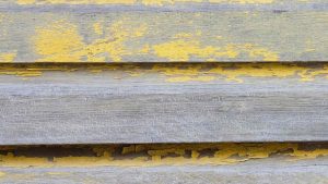 Faded exterior paint on house siding