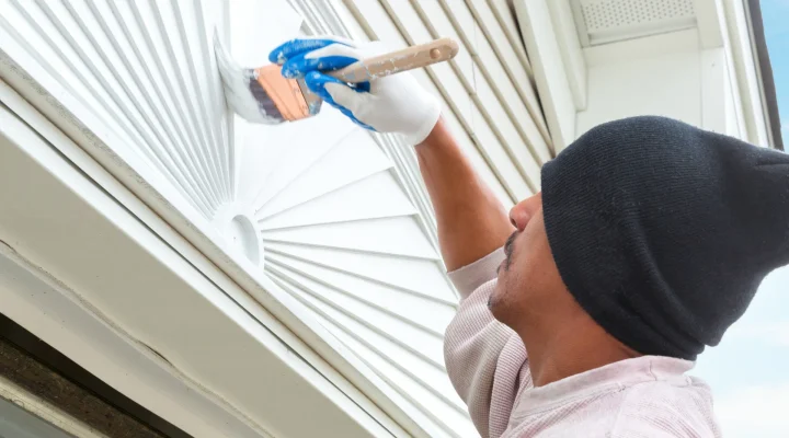 Exterior painter working in shade