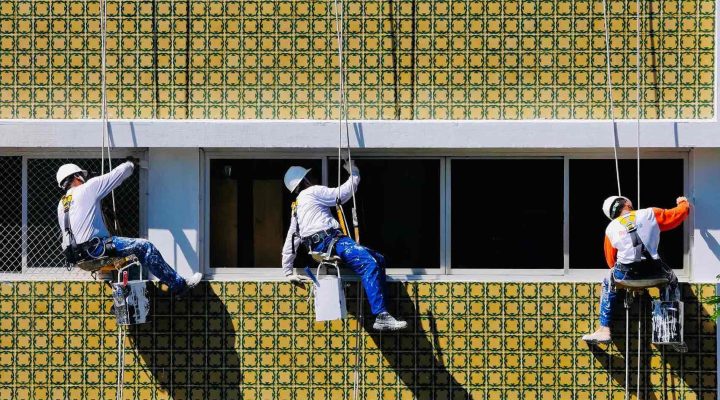 Commercial painters working while a business remains open