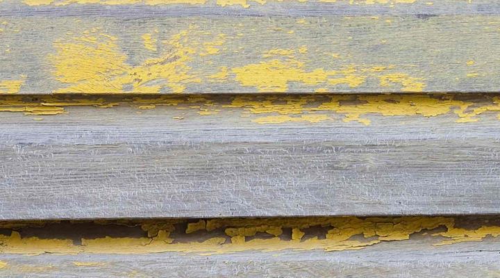 Faded exterior paint on house siding
