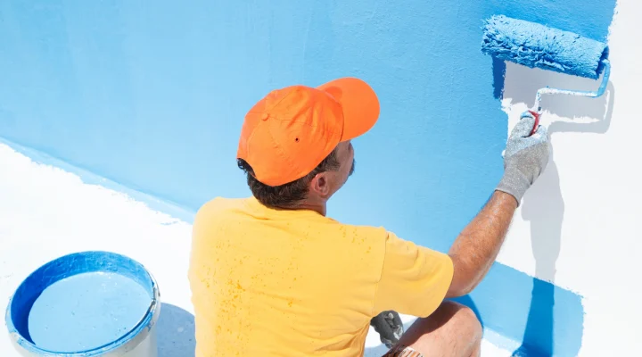 Freshly painted pool house with mildew-resistant exterior paint
