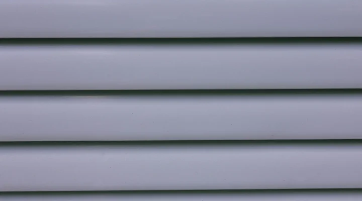 Freshly painted vinyl siding on home exterior