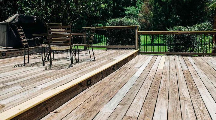Wooden deck showing signs it may need restaining